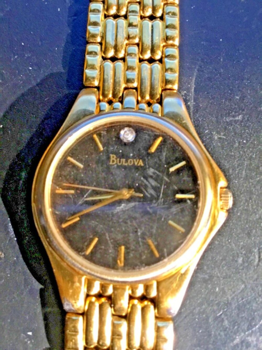 Bulova Men's Gold-Tone Diamond Accent Watch== scratched crystal=working watch